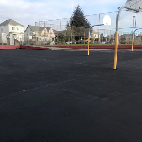 Franklin Elementary's current playspaces with blacktop and rimless backboards