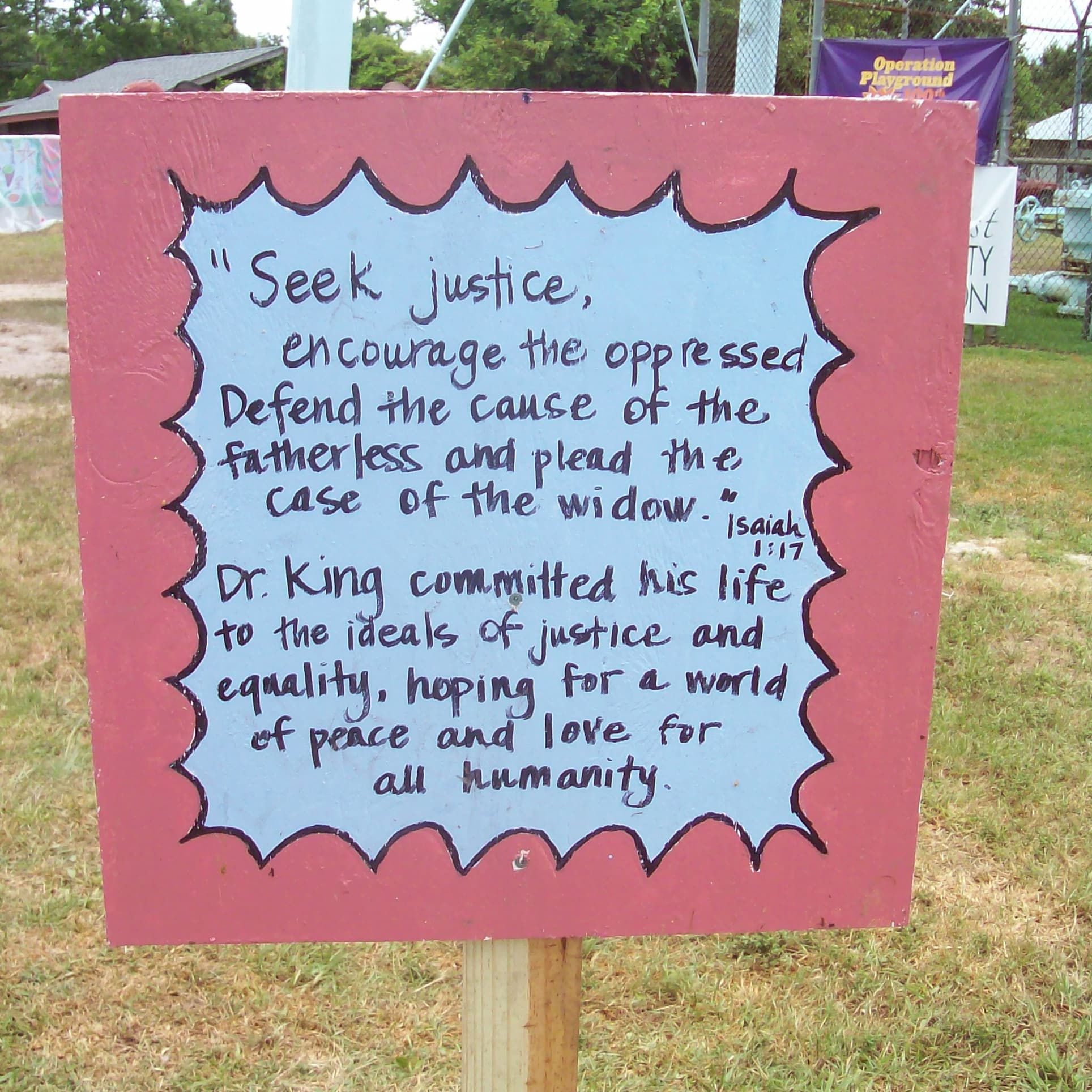 Sign depicting the verse Isaiah 1:17, honoring the life of Dr. Martin Luther King, Jr.