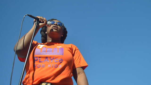 black-woman-speaks-to-volunteers-og